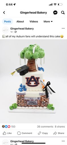 a three tiered cake is decorated with green and white icing, topped with an auburn logo