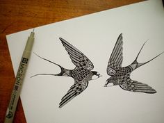 two birds flying next to each other on top of a white paper with a marker