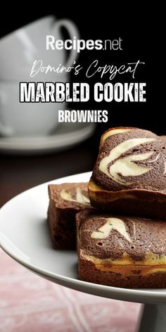 marbled cookie brownies on a plate with coffee in the background and text overlay