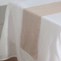 a table with a white and beige cloth on it