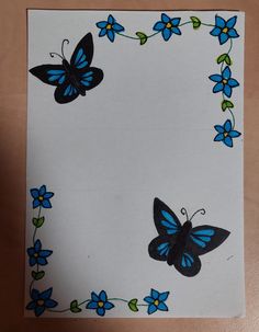 a piece of paper with blue and black butterflies on it