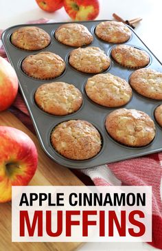 muffins in a pan next to apples and cinnamon sticks