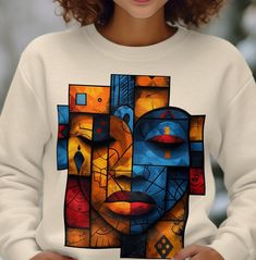 This cute colorful sweatshirt with African art aesthetic makes a great gift. Cozy and comfortable, making it ideal for colder months. Please note: Due to variations in display settings, the shirt color might look slightly different on your screen than in person. Processing Time: - 2 to 5 Business days processing time.  Return Policy: - All items are made-to-order. Therefore, we can't accept returns unless they arrive damaged or defective. Ideal for any situation, a unisex heavy blend crewneck sw Casual Multicolor Graphic Print Sweater, Multicolor Relaxed Fit Sweatshirt For Winter, Multicolor Relaxed Fit Winter Sweatshirt, Multicolor Crew Neck T-shirt For Winter, Multicolor Graphic Print Fall Sweatshirt, Casual Multicolor Screen Print Sweatshirt, Casual Multicolor Sweatshirt With Screen Print, Artistic Cotton Sweatshirt For Winter, Multicolor Long Sleeve Sweatshirt With Screen Print