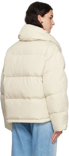 Acne Studios.Off-White Quilted Down Jacket.Down-filled quilted recycled polyester taffeta jacket..· Funnel neck.· Zip closure with press-stud placket.· Logo printed at chest.· Concealed bungee-style drawstring at hem.· Full recycled nylon taffeta lining.Supplier color: Milk white.Fill: 90% recycled down, 10% feather..Body: 100% recycled polyester. Lining: 100% recycled nylon..Made in China..232129F061005 Winter White Nylon Puffer Outerwear, White Down Puffer Outerwear, Winter White Quilted Nylon Outerwear, Quilted Nylon Outerwear In Winter White, White Down Outerwear With Padded Collar, White Nylon Puffer Jacket With Padded Collar, White Quilted Down Outerwear, White Quilted Puffer Jacket With Long Sleeves, White Quilted Puffer Jacket