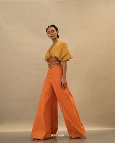 The ILO HIGH WAIST PANTS features the beautiful, in-house designed SUNSET embroidery on the narrowest point of the waist to hug the body in all the right places. 50% Viscose/40% Linen/10% Cotton High waisted pants Ultra-wide leg Embroidered corset waistband Inseam is 34.5" CB invisible zipper closure Hand wash cold, line dry Fits true to size S Model is 5'8 wearing a size S, XL model Height is 5' 9"; Bust 37"; Waist 33"; Hip 45"; Dress 12-14 US Womens Pants 2023, Women’s Fashion Spring Summer 2023, Unique Dresses Creative, Unique Outfits Creative Fashion, Orange Pants Outfit, Outfits Illustration, Sunset Embroidery, Payal Khandwala, Andrea Iyamah