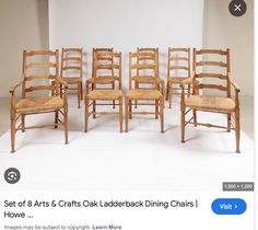 a bunch of chairs that are sitting next to each other on a white floor with the caption set of 8 arts & crafts oak ladderback dining chairs