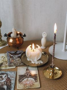 a table with candles and pictures on it