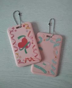 two tags with hearts and flowers on them