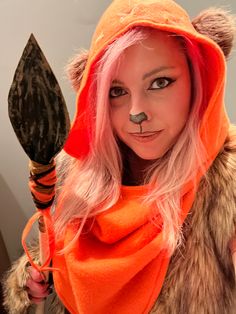 DIY Ewok women’s costume.  Orange hood with brown fur ears.  Brown fur vest.  Handmade spear from a walking, foam sheets, paint, pipe cleaners, and felt fabric. Ewok makeup using black eyeliner and brown & orange eye shadow. Wookie Costume, Star Wars Themed Party, Star Wars Theme Party