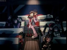 an anime scene with many people sitting on the seats and one person standing in front of them