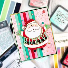 a close up of a christmas card on a table with other cards in the background