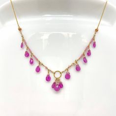 "Wire, Chain & Clasp: 14k Gold Stones: Pink Sapphires (approx. 3.5mm), Freshwater Pearls (approx. 1mm x 2mm), 18k Gold Daisy (approx. 2mm), 18k Gold Loop (approx. 5mm) Beads: Antique Italian Glass (approx. 1mm) Necklace Length: approx. 17\" Backdrop: Sapphire & Antique Italian Beads Backdrop Length: 1.6\" ------------------------------------------------------------ Let me know if you have any questions! *Size adjustable at client's request 693" Fine Jewelry Faceted Briolette Necklaces, Fine Jewelry Briolette Faceted Necklace, Yellow Gold Briolette Necklaces With Faceted Beads, Yellow Gold Briolette Necklace With Faceted Beads, Yellow Gold Briolette Gemstone Bead Jewelry, Yellow Gold Gemstone Dangle Necklace, Briolette Beaded Chain For Jewelry Making, Fine Jewelry In Yellow Gold With Faceted Beads, Pink Faceted Beads Necklace For Celebration