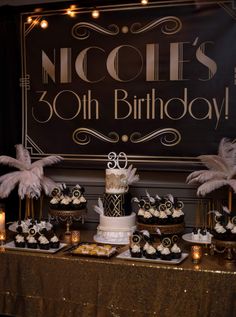 a table topped with cakes and cupcakes next to a sign that says nicole's 30th birthday