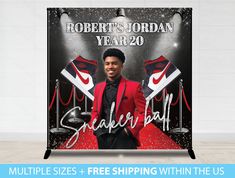 a man in a red suit standing next to a sign that says robert jordan year 20