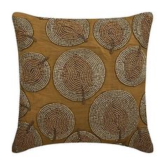 a brown pillow with circles on it