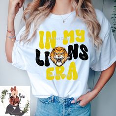 a woman wearing a t - shirt that says i'm my lions era