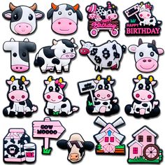 a bunch of cow magnets that are in the shape of houses and farm animals