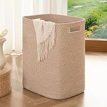 a basket sitting on top of a wooden floor next to a window