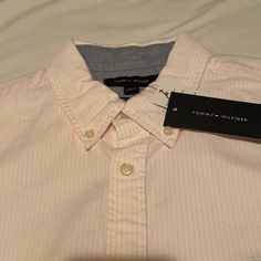 Brand New. Pink & White Stripes. 100% Cotton Oxford Cloth. Size Medium. Custom Fit. Cut Tighter Than Regular Fit. Shoulder To Shoulder 18”. Armpit To Armpit 21”. Length 30”. Tommy Hilfiger Spring Short Sleeve Shirt, Tommy Hilfiger Short Sleeve Shirt For Spring, Tommy Hilfiger Button-up Summer Tops, Tommy Hilfiger Summer Button-up Top, Tommy Hilfiger Summer Button-up Shirt, Tommy Hilfiger Button-up Tops For Spring, Tommy Hilfiger Long Sleeve Summer Shirt, Tommy Hilfiger Spring Workwear Shirt, Tommy Hilfiger Classic Summer Tops