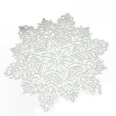 a paper snowflake on a white background with the shape cut out to look like it