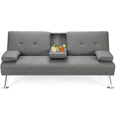 a gray couch with two trays on it