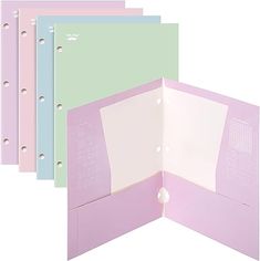 five different colored folders with holes in the front and back, all lined up together