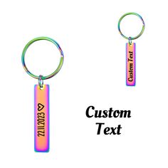 two key chains with the words custom text on them