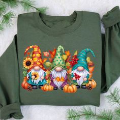 Fall Gnomes Sweatshirt, Cute Gnome Sweater, Thanksgiving Gnomes Sweater, Gnomes Fall Sweatshirt, Fall Vibes Hoodie, Autumn Graphic Sweater Welcome to our small family business Glamour Apparel. Your go-to place for all your shirt needs. We as Glamour Team offer ultra-soft shirts made with the highest quality fabrics for you. Our shirts are custom-made prints with the latest technology for long-lasting shirts. Our Products 👕👚 ✓ Our shirts are handmade in the USA, designed, and shipped from our warehouse in Texas. ✓ Our products are durable, extremely soft, stylish, vibrant colored shirts made in an eco-friendly process. ✓ We use Gildan Sweatshirts and Hoodies.  ✓ Our All Sweatshirts and Hoodies are Gildan and they provides awesome softness as poly cotton mix materials. SIZING QUESTIONS  👚 Graphic Sweaters, Gildan Sweatshirts, Fall Sweatshirt, Oversized Shirt, Fall Vibes, Quality Fabric, Colorful Shirts, Sweatshirts Hoodie, Tops & Tees