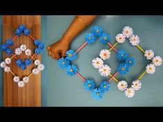 two pictures with flowers on them, one is made out of paper and the other has yarn