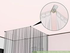 a white curtain hanging on the side of a building with a hole in it's center