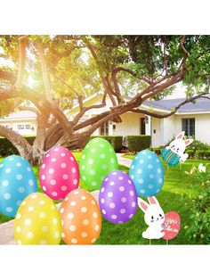 easter eggs and bunnies in front of a house