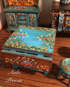 an assortment of colorful painted furniture on display