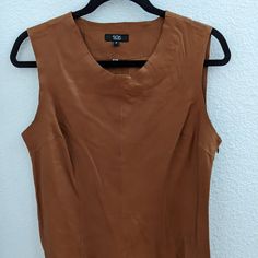 Nwot Brown Leather Sleeveless Shell Top Sz 8 Sas Sportswear Never Worn 100% Leather Some Seam Stitching Is A Little Loose, See Pictures Always Open To Offers! Fitted Brown Sleeveless Tank Top, Brown Summer Workwear Vest, Fall Sleeveless Tank Top, Chic Brown Tank Vest, Brown Sleeveless Tank Top For Spring, Brown Sleeveless Tank Top For Fall, Brown Sleeveless Blouse For Spring, Shell Top, Shell Tops