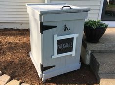 a trash can sitting on the side of a house