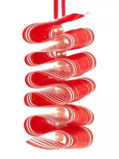 red and white ornaments hanging from a string