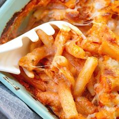 a casserole dish with pasta and cheese in it, ready to be eaten