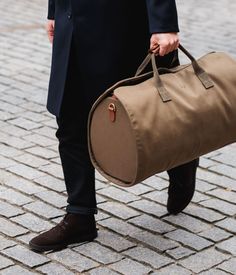 Bennett Winch's suit carrier holdall is a must-have | Gentleman's Journal Harry Potter Napkins, Suit Carrier, Crockett And Jones, Wrap Carrier, Lightweight Bag, Triumph Motorcycles, Waterproof Shoes, Great British, Work Bags