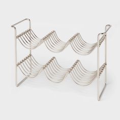 a metal rack with several rows of wire on it