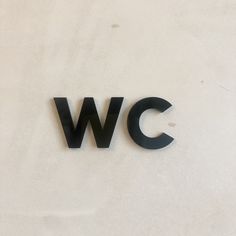 the letters w c are black against a white background and there is no image here to provide a caption for