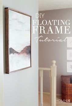 the frame is hanging on the wall in front of a door with an advertise for