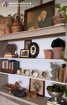 a shelf filled with lots of books and pictures