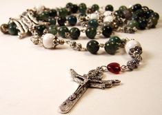 This beautifully hand-crafted rosary is made from reclaimed vintage jewelry beads, Tibetan silver and finished off with a Swarovski heart. Will ship in a black velvet rosary pouch. Our beautifully handcrafted rosaries, chaplets, and jewelry are designed to inspire... Note: Shipping overages over $1 are automatically credited back to your account. All items ship immediately. If you need additional images, info please do not hesitate to contact us. Spiritual Silver Beads Rosary Gift, Silver Rosary With Natural Stones For Gift, Silver Rosary With Natural Stones As A Gift, Handmade Silver Rosary For Healing, Swarovski Heart, Reclaimed Vintage, Agate Beads, Virgin Mary, Dream Jewelry