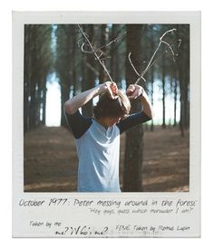 a man holding two branches in front of his head with the words october 1971 written on it