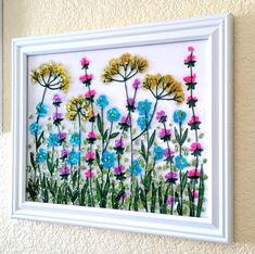 a white frame with flowers painted on it