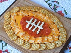 a football shaped cheese and cracker platter