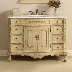 an antique style bathroom vanity with two faucets on the top and one sink