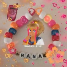 there is a bracelet made out of candy and plastic beads with the name hannah on it