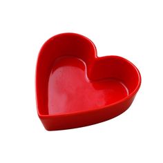 a red heart shaped dish on a white background