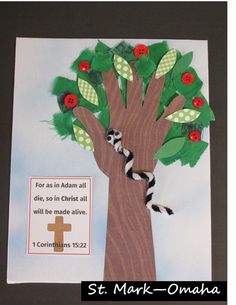 a paper tree with green leaves and red buttons on it, next to a card that says st mark - o'anana