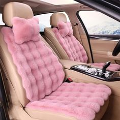 the interior of a car is decorated with pink fur and plush seats, including one that has a teddy bear on it